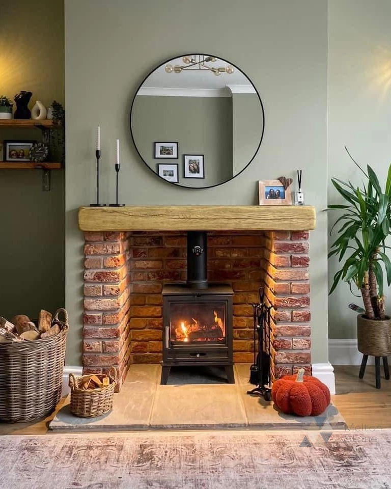 Stove with brick surround and oak beam